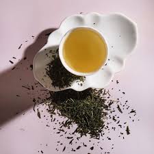 A steaming cup of HLO Immunity Boost Tea showcasing the Sencha.